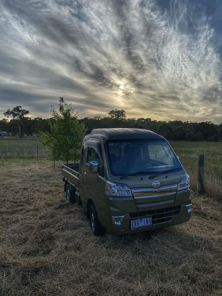 kei truck in front of a sunset